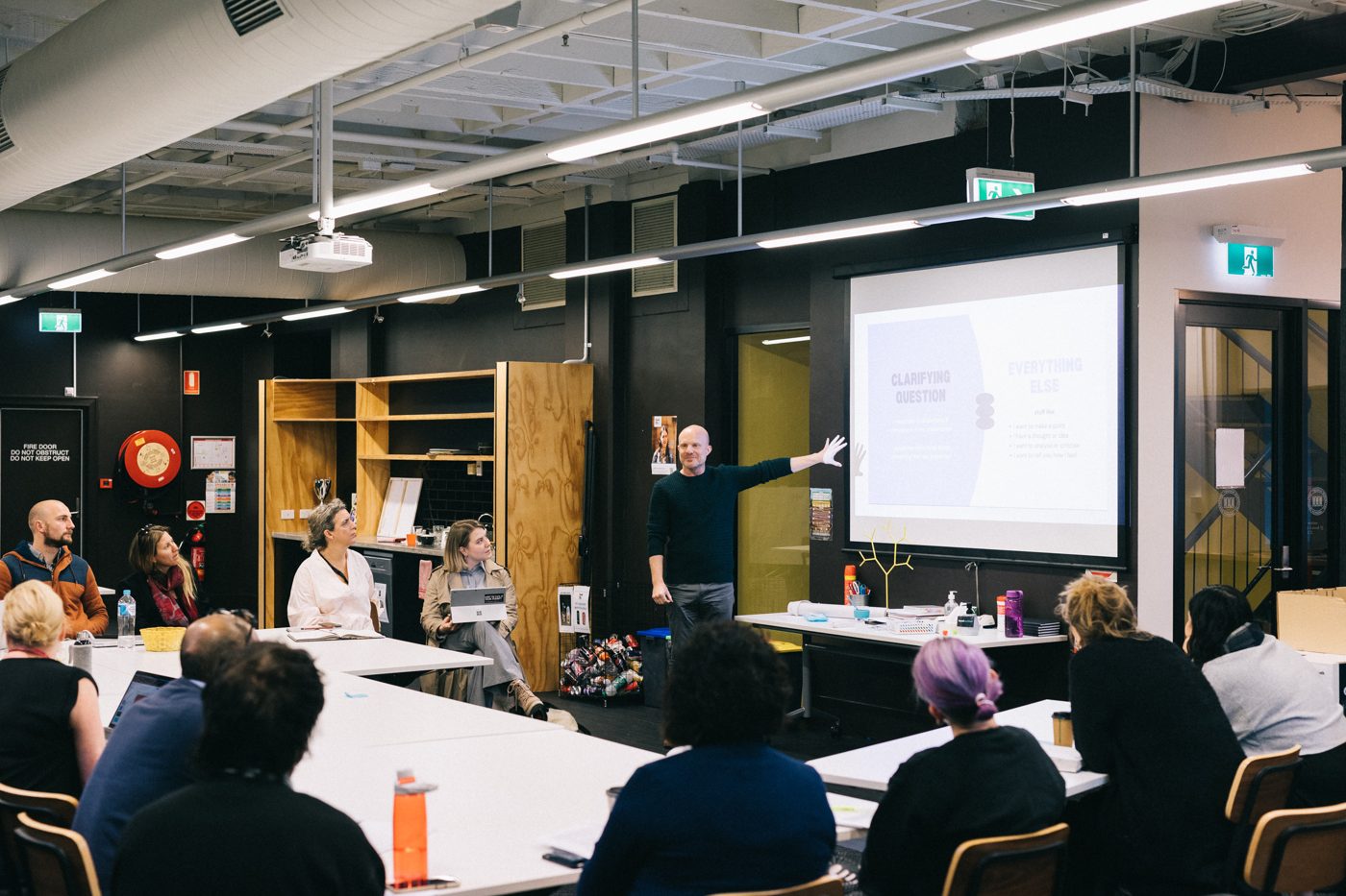 Paul Mayers facilitating a consulting workshop with a group of professionals
